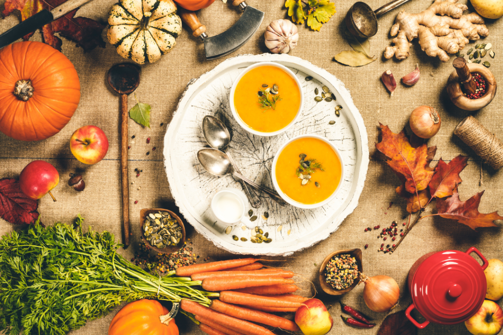 Autumn harvest soup with pumpkins and vegetables.