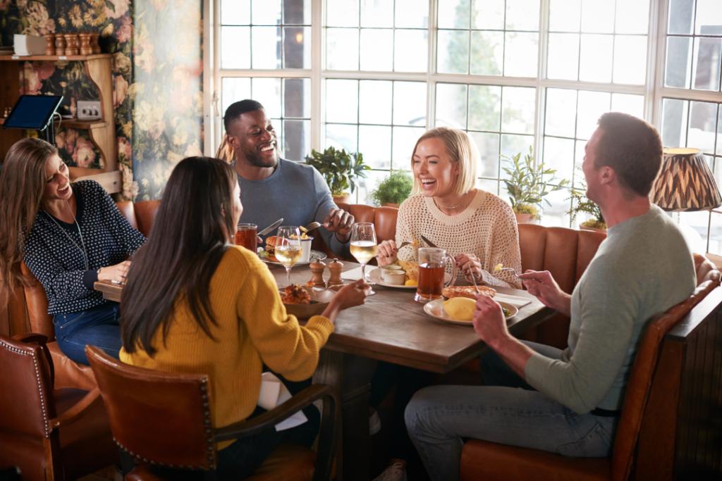 Friends enjoying lunch at a cozy restaurant.